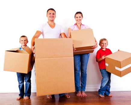 Professional movers handling apartment furniture in a St Johns Wood residential building