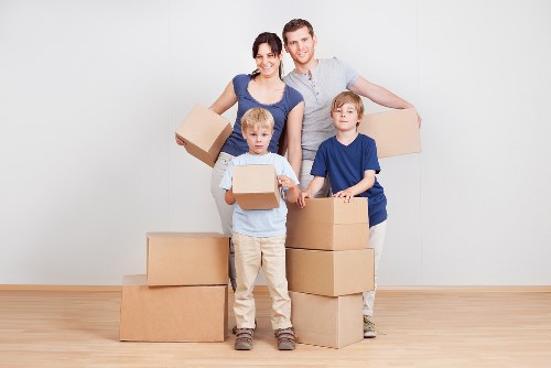 Packed boxes and furniture ready for collection during a local house move