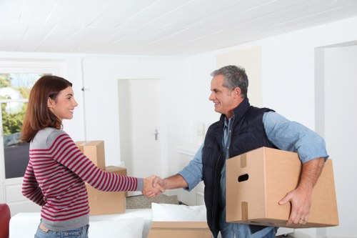 Professional movers coordinating a property move with careful loading and access planning