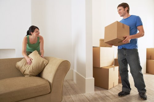 Loading household items into a moving truck with careful planning in St Johns Wood